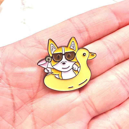 Corgi Floaty Enamel Pin featuring a relaxed corgi in a colorful summer float.