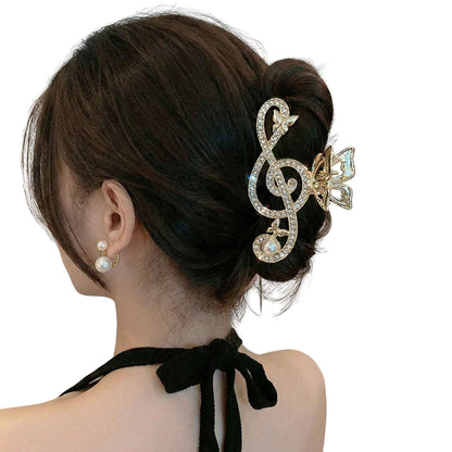 Treble Clef Hair Clip with gold tone metal and sparkling clear rhinestones